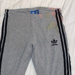 Gray adidas leggings with flower detail.